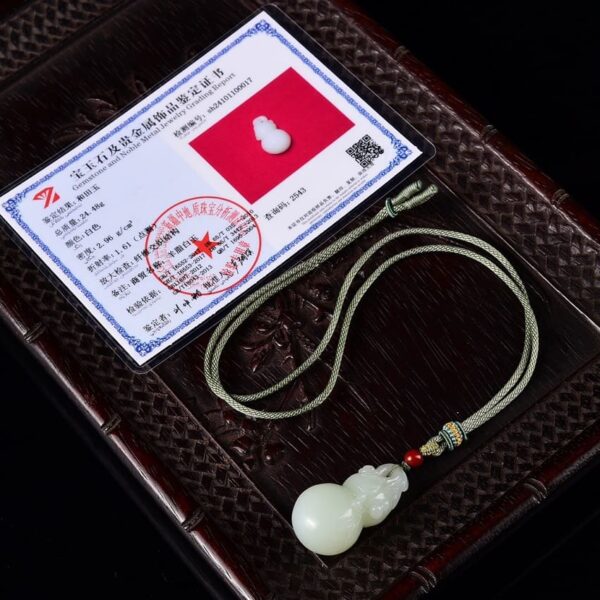 Certificate for the elegant Hetian Jade Fu Lu Shou Gourd pendant, highlighting its auspicious design and rich color.