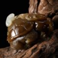 Close-up of exquisite Dragon Turtle carving on Hetian Jade handpiece, highlighting rich oily texture and vivid details.