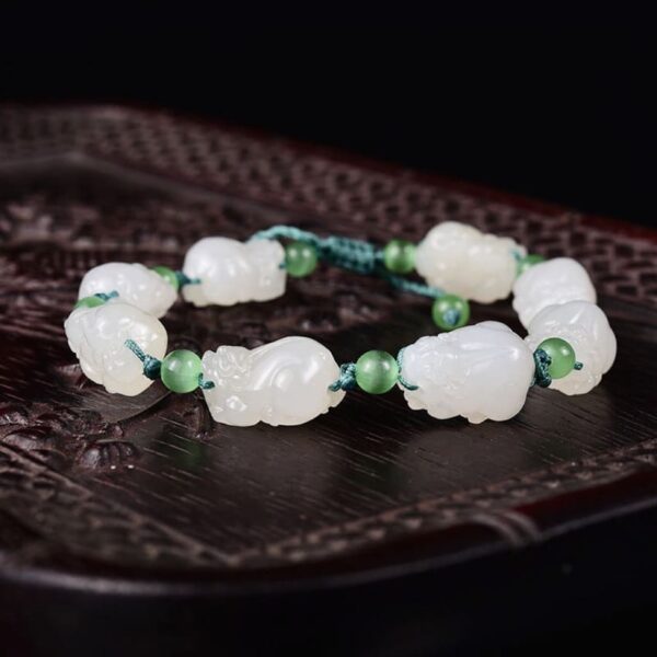 Perfect Natural Hetian Jade Mutton Fat Pixiu bracelet with 8 unique carvings, symbolizing wealth (1)
