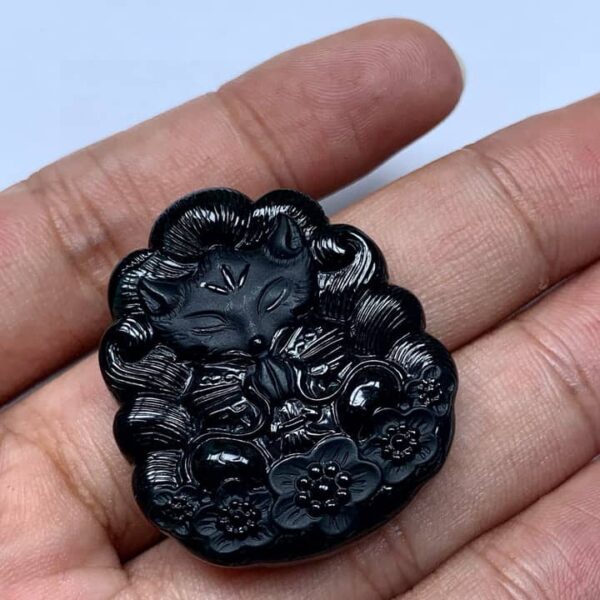 Perfect Natural Ink Jadeite Nine-Tailed Fox Pendant, showcasing its mysterious black color in normal light.